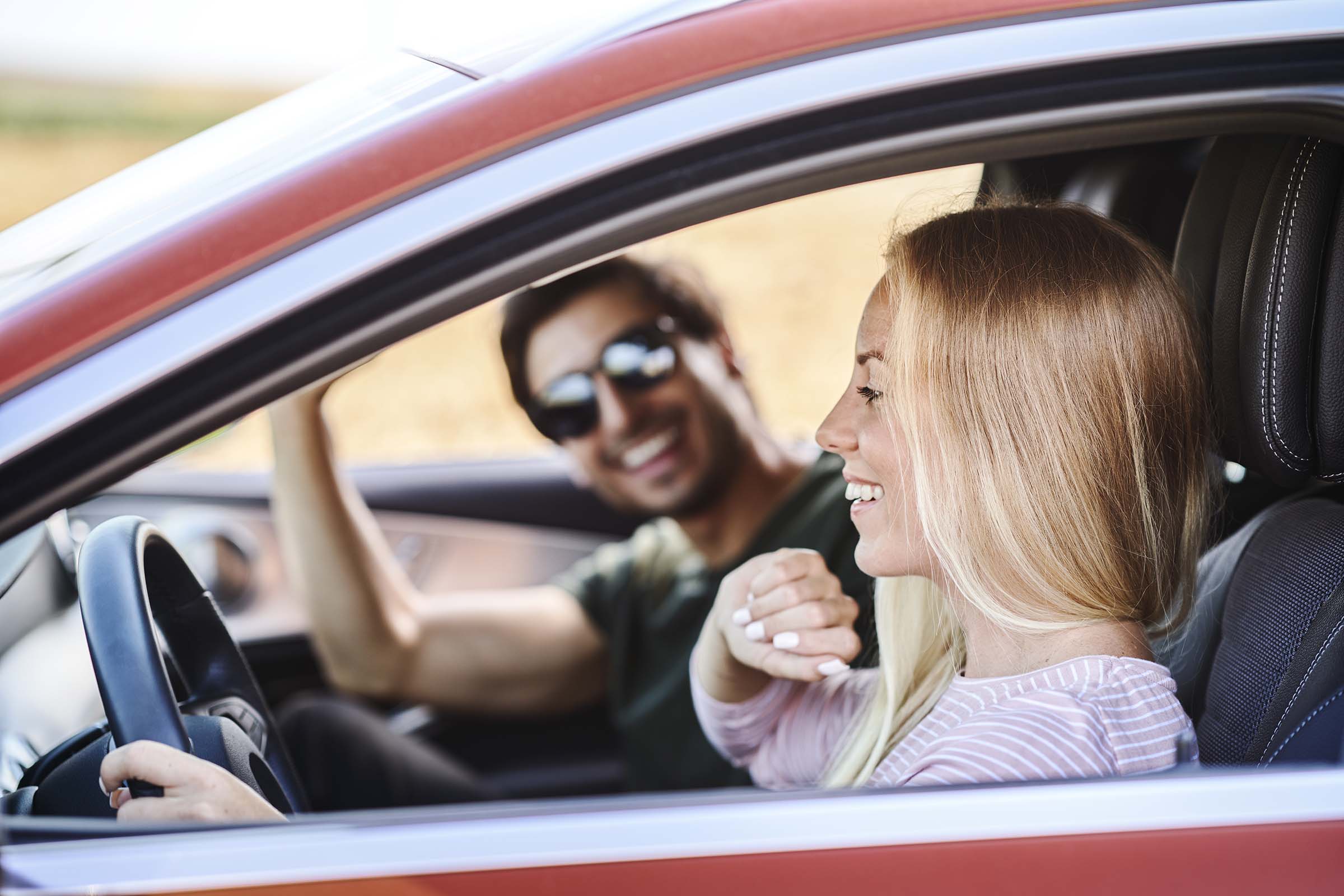 couple-driving-in-the-car-M5H7HBA.jpg